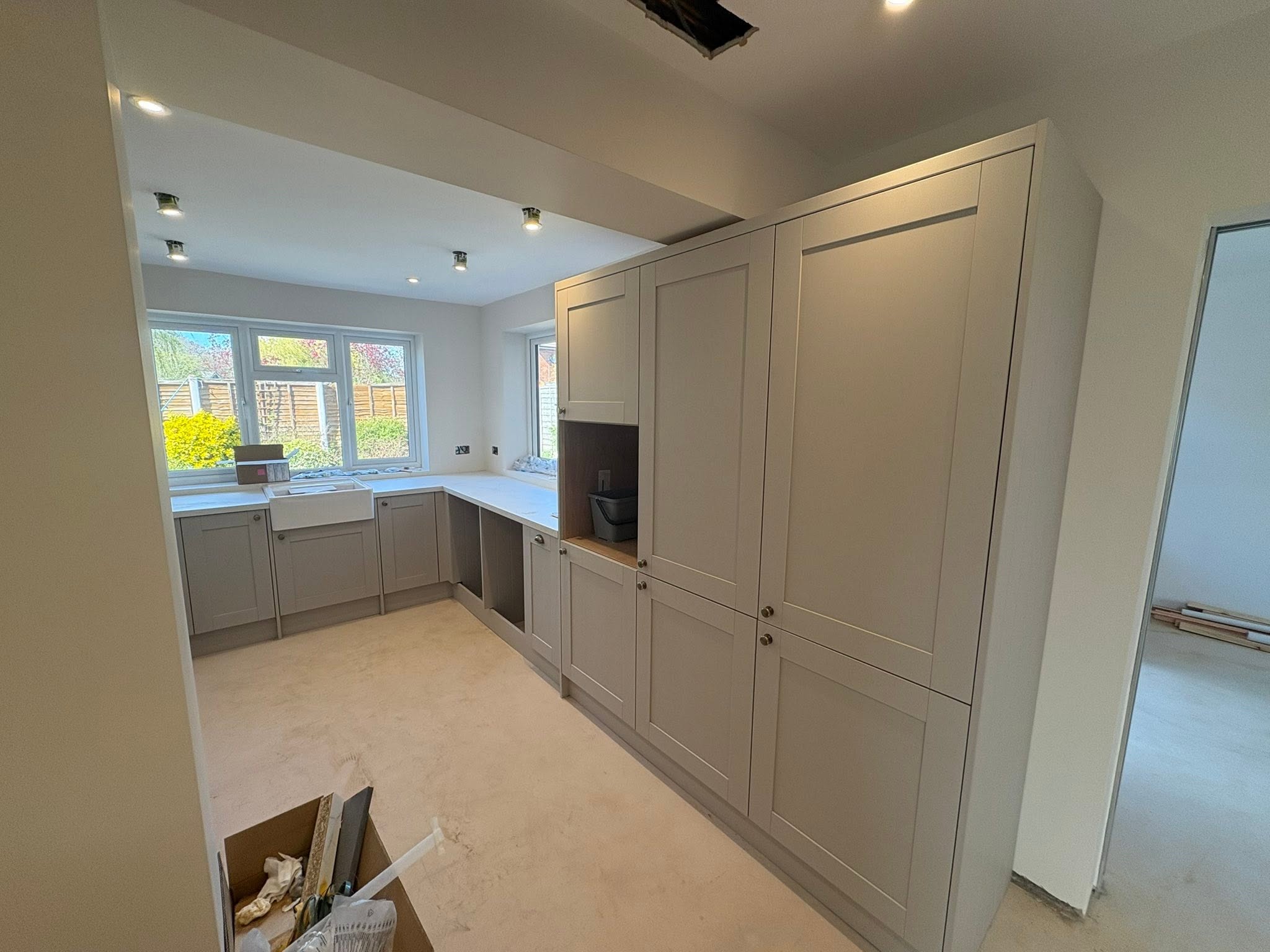 Taupe shaker kitchen with tall larder units